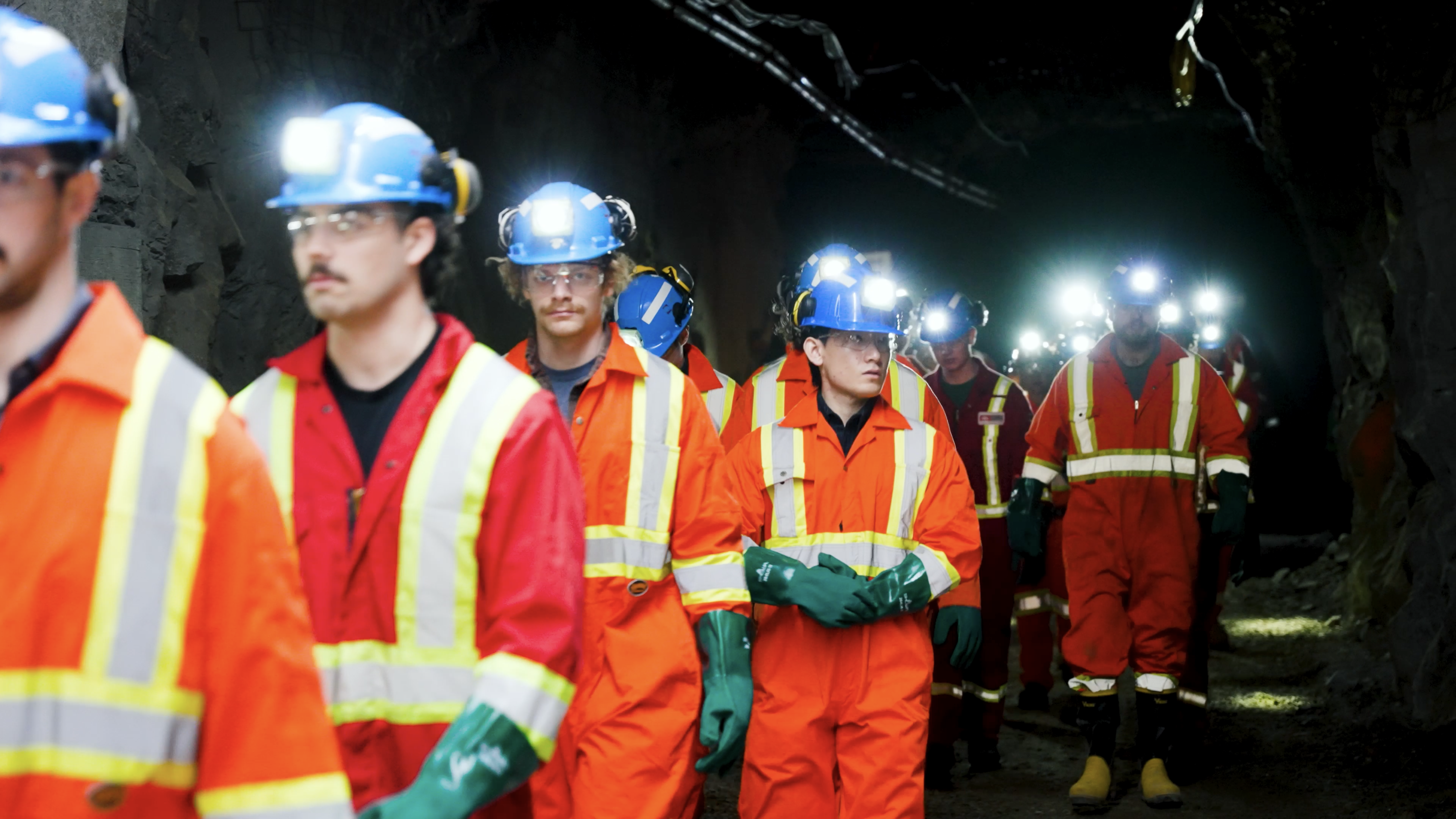 Line up of Ontario Mining workers in PPE